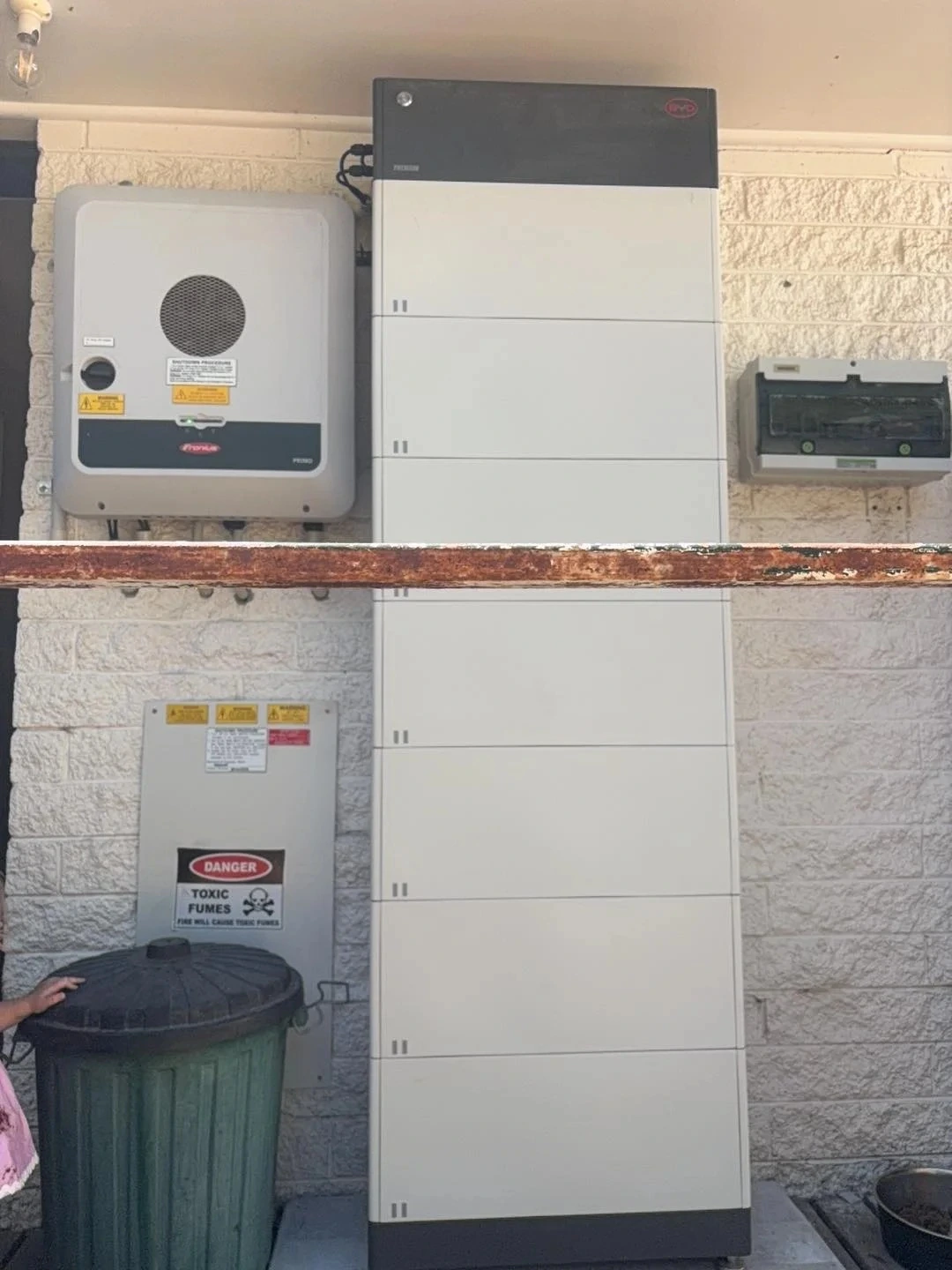 Solar battery and inverter installed on a house wall